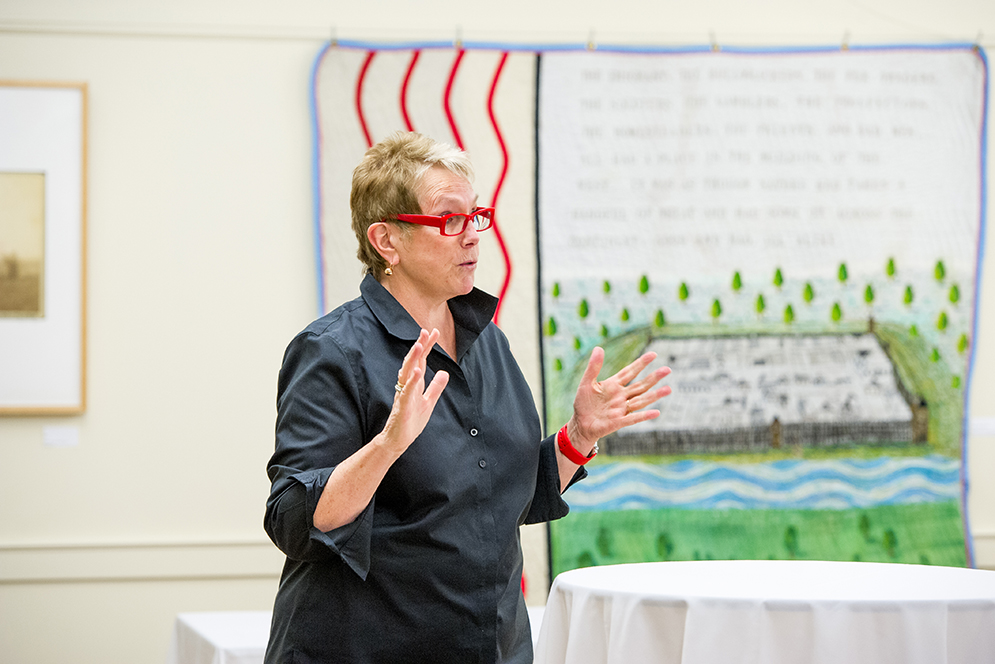 Lynne Allen, the current dean ad interim and professor at CFA attends the opening reception April 6, 2016 for her show Cultural Truth: Conflict and Empathy, displayed in STH in their basement lounge area. Allen traces her heritage six generations back to Ita ta Win (Wind Woman), depicted in a digital print piece in the exhibit, and says that every matriarch in her family has been a member of the Standing Rock Indian Reservation in South Dakota. The exhibit runs thru April 29. Photo by Cydney Scott
