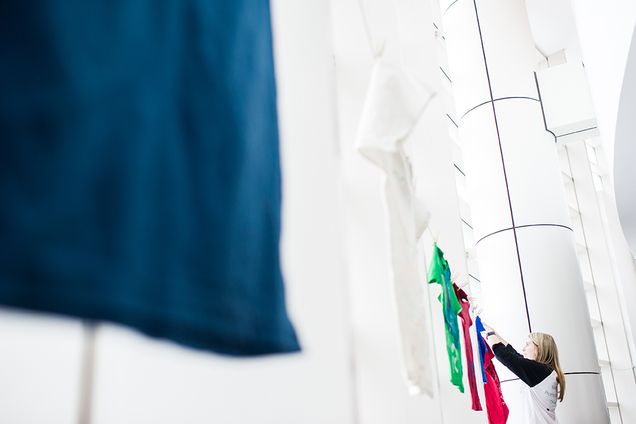As part of Sexual Assault Awareness Week SARP ambassador, Catherine Muldoon (CAS 17) hangs T-shirts at FitRec for the Clothesline Project on Monday, April 4, 2016. The Clothesline Project is a visual display of shirts designed by Terriers who are survivors of interpersonal violence, or loved ones of survivors of interpersonal violence. Photo by Jackie Ricciardi 
