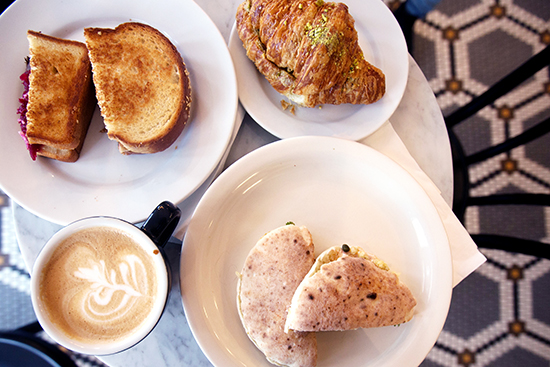 While the pistachio croissant (upper right) is a longtime favorite, Tatte’s recently expanded menu has added to its lunch menu with a short rib grilled cheese sandwich and a roasted cauliflower sandwich.