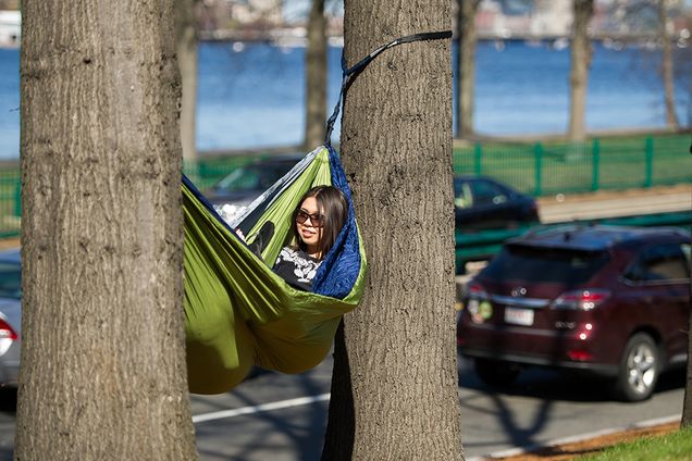 In late April, Jamie Morishima (CGS’19) and her hidden friend Molly Martel (SAR’19) found a way to enjoy long-awaited spring weather—and do a bit of finals prep—while cradled in the comfort of Morishima’s hammock on the BU Beach. Photo by Cydney Scott