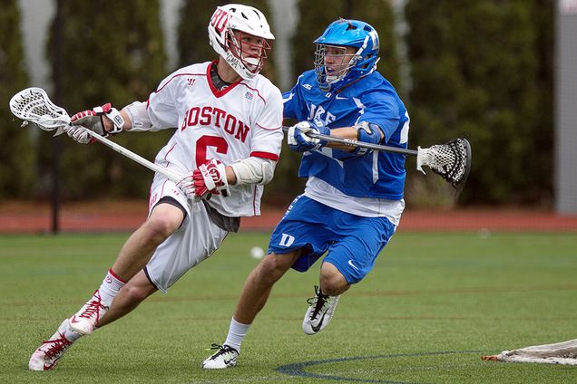 Jack Wilson (Questrom '18) (left), faces off against Ethan Powley of Duke University during the final game of the men's lacrosse season at Nickerson Field Sunday. The Terriers fell to Duke 15-8. In April, Wilson became the program's first Academic All-Patriot League selection. Photo by Alexandra Wimley (COM ’17)