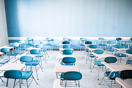 Desks in a classroom.Photo by Conor Doherty for Boston University Photography