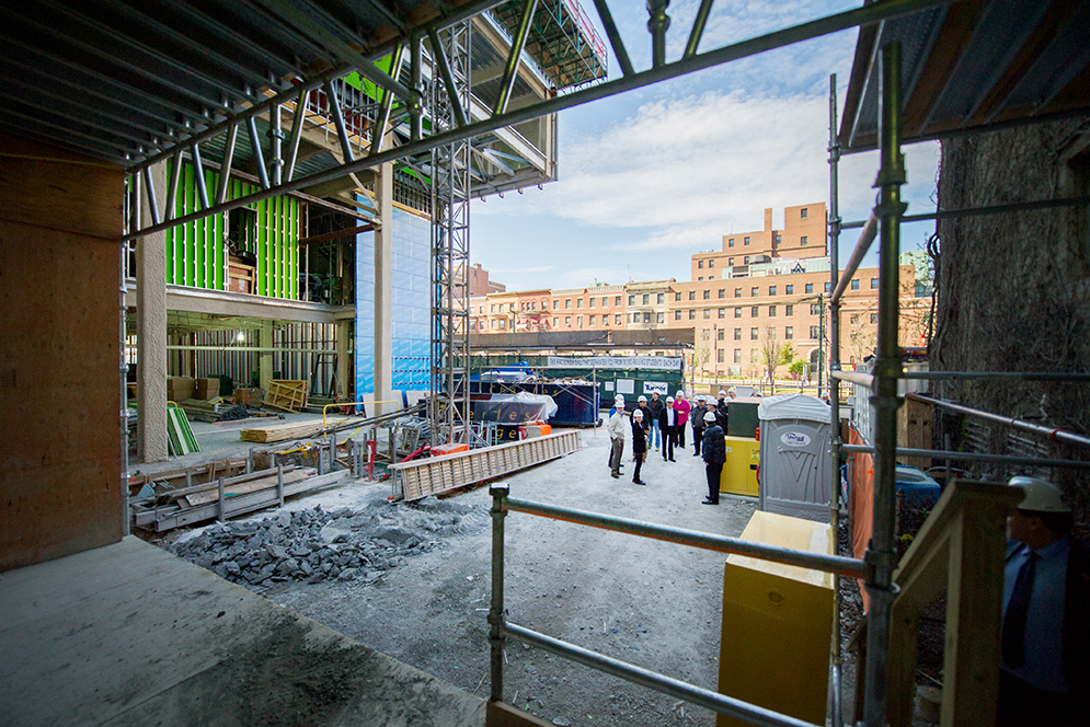 The Center for Integrated Life Sciences & Engineering (CILSE) architect Charles Klee gives a tour of the construction progress on Friday, April 29. This $150 million, nine-story, state-of-the-art research facility broke ground in May 2015 and when completed in spring 2017 will bring together life scientists, engineers, and physicians from the Medical and Charles River Campuses. Photo by Jackie Ricciardi 