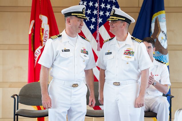 Captain Steven M. Benke, US Navy, at right, relinquished command of BU-MIT Navy ROTC to Captain James E. Horten, US Navy, left, June 10, 2016 at a Change of Command Ceremony at 10 Buick Street. The Change of Command Ceremony is a time honored Naval tradition, formally restating the continuity of the authority of command. Photo by Cydney Scott 