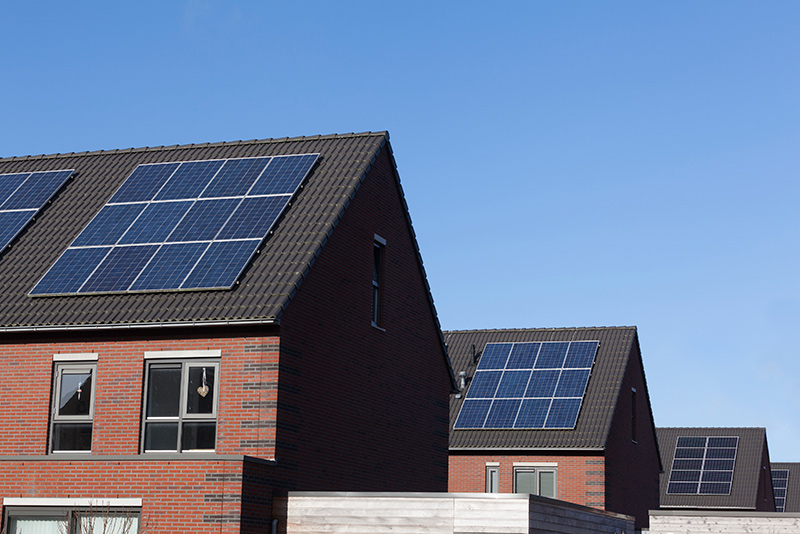 mulitple homes with rooftop solar arrays