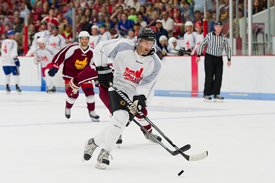 Jay Pandolfo skates with the puck during the 2015 Comm Ave Charity Classic hockey game