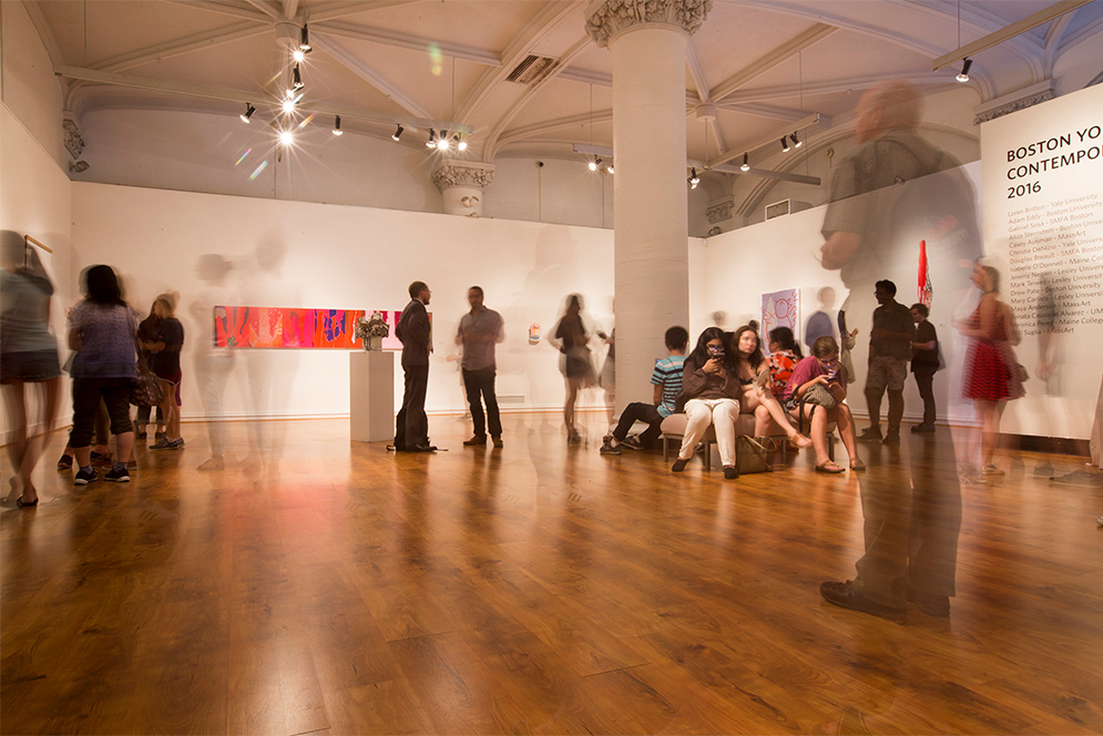 Visitors in the Stone Gallery at Boston University during the opening reception for a new exhibit entitled Boston Young Contemporaries
