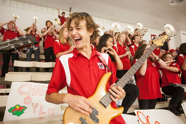 Bassist Simon Nichols performs with the Boston University band at the Comm Ave Charity Classic hockey game at Walter Brown Arena, 
