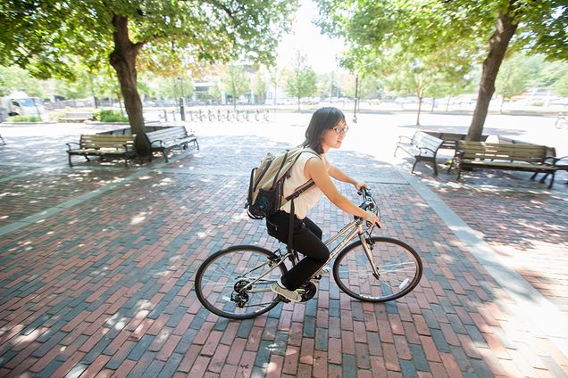 Student riding her bike from the George Sherman Union