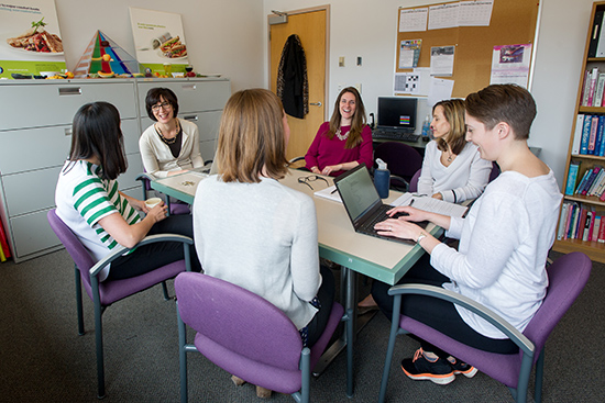 Stacey Zawacki (SAR’98, SPH’13) (far left), director of Sargent Choice Nutrition Center, and center members at a weekly staff meeting