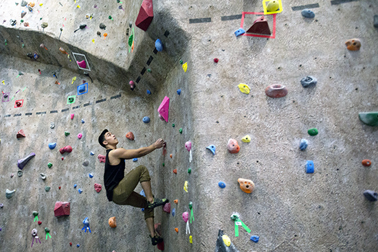 Jesse Batson (ENG '17) climbing up wall
