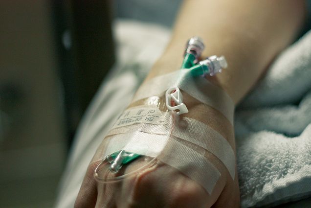 Woman with IV in hand