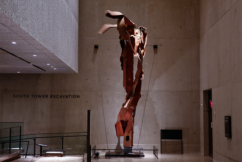 22-foot-tall pillar of torn steel from the spot where Flight 11 crashed into the North Tower of the World Trade Center on display at the 9/11 Memorial Museum in New York City