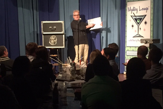 A performer on stage during the Mystery Lounge comedy and magic show at the Comedy Studio in Harvard Square, Cambridge, MA