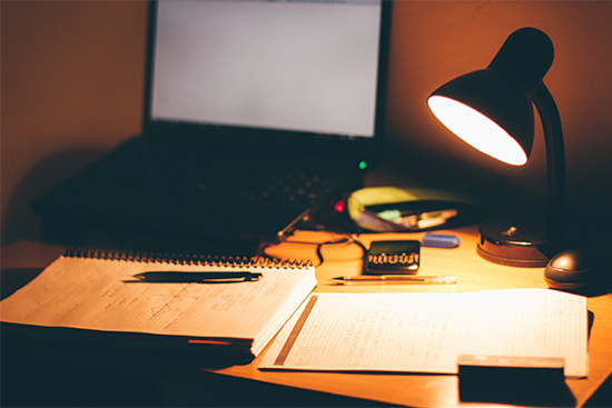 dorm room desk with desk lamp