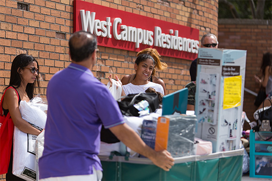 Students and parents move personal items into dorm residences on Boston University Charles River Campus during Fall Semester move-in week, 2015