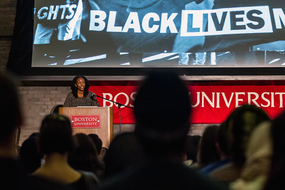 Professor Saida Grundy speaking behind the podium at the 2016 Rhett Talks event