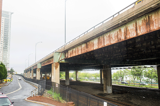 train tracks under a bridge