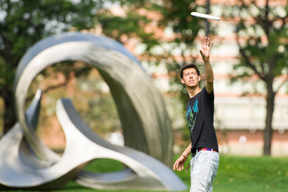 Zander Allman (CAS'19) playing frisbee