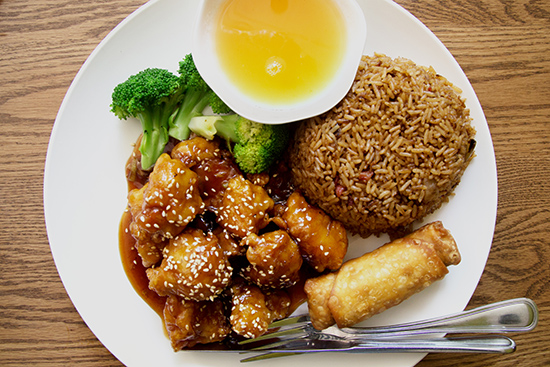 Plate of sesame chicken, broccoli and beef, seafood deluxe, and drunkard’s noodles from ZC Boston