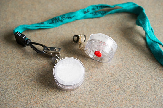 passive nicotine monitor around their necks