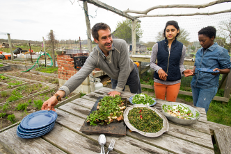 Chris Fischer serves a locally sourced dinner prepared with the help of Boston University Gastronomy students at Beetlebung Farm