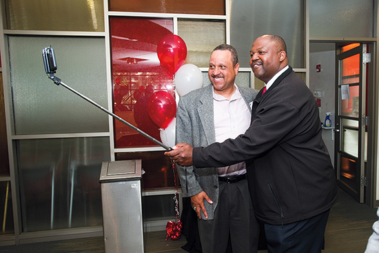 Albert James (ENG’85, Questrom’95) (left) and Terry Anthony (ENG’86) snap a selfie