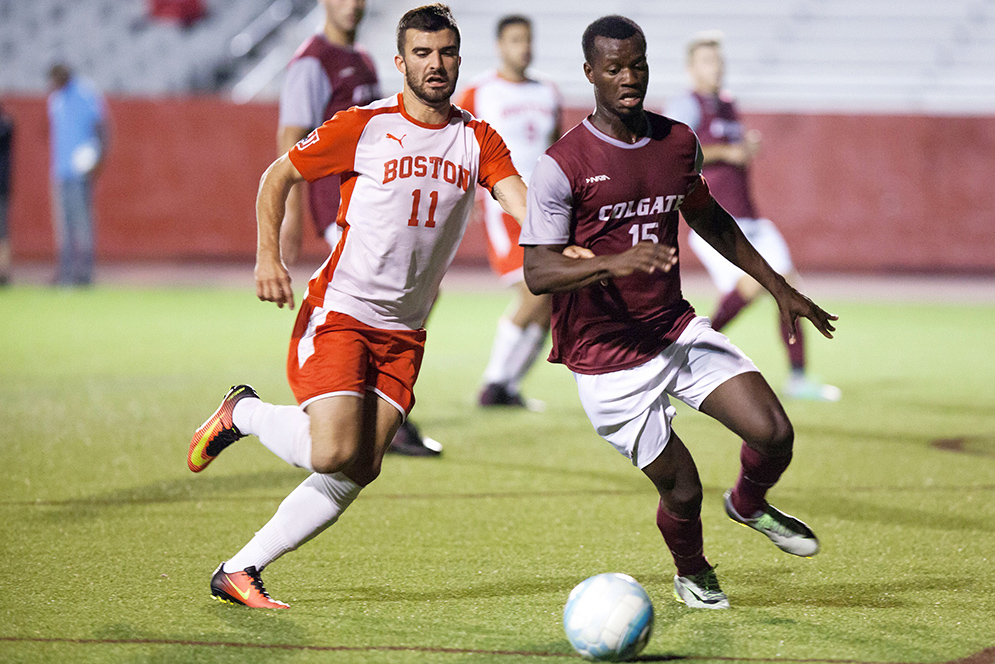 Felix De Bona (CAS '17) (left) battles Colgate's Zach Tomen for the soccer ball 