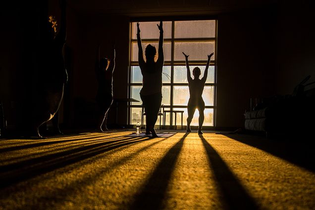 Students doing yoga early in the morning