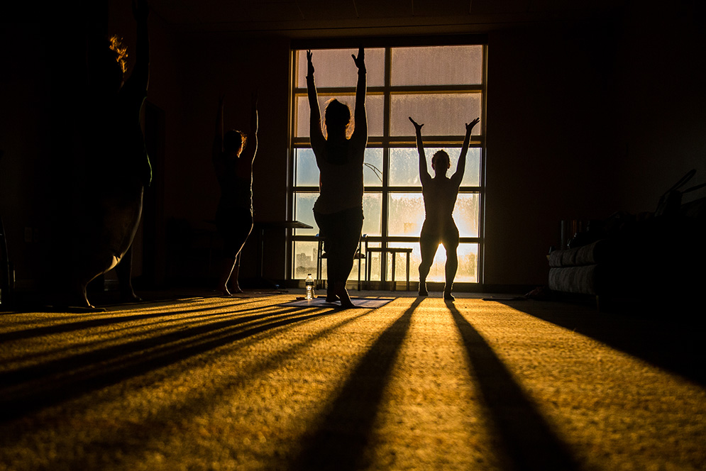 Students doing yoga early in the morning