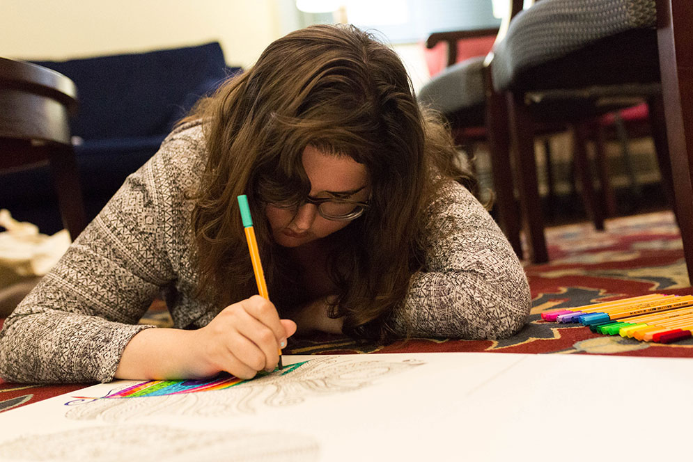 Maritt Nowak (CAS’18)  draws some art work at Create Space