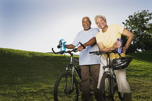 elderly couple riding bikes