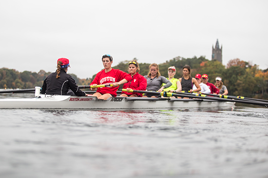 rowing team practicing on the Charles River
