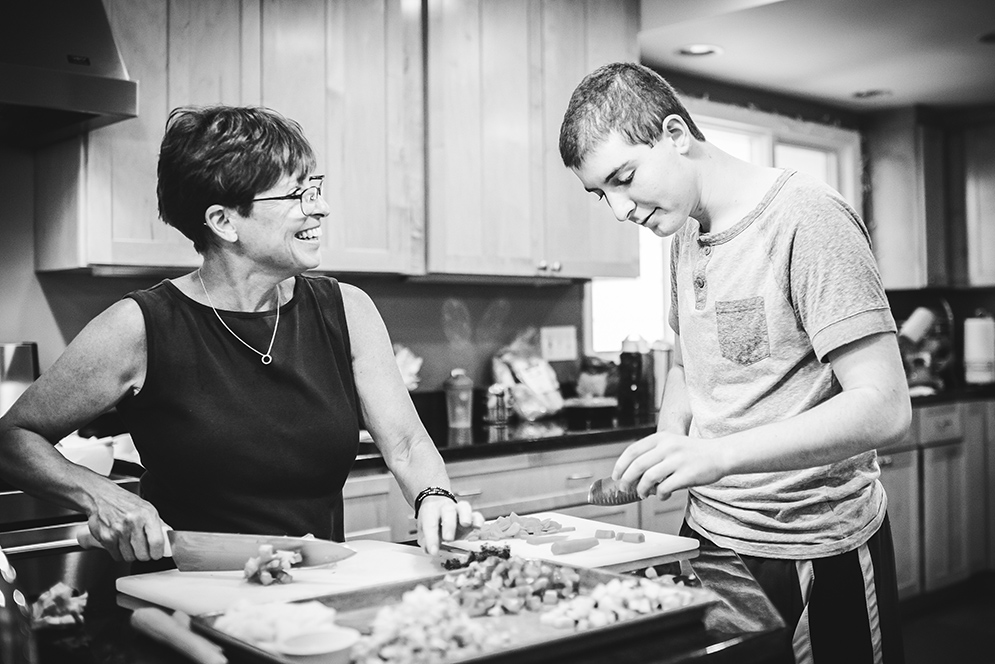 Skylar helps his mother, Mary Jo make dinner at their home