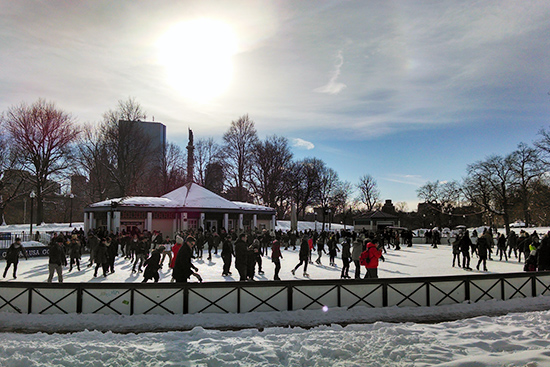 ice skaters skating on Frog Pond
