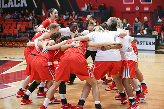 Women's basketball team in a huddle