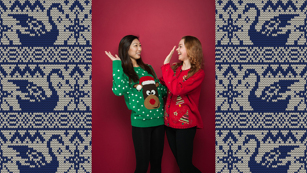 Keri Yang and Andrea Rusted in their ugly holiday sweaters