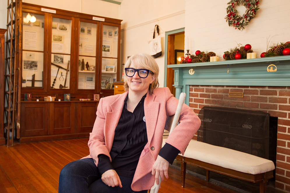 Photo of Kyna Hamill sitting on a chair