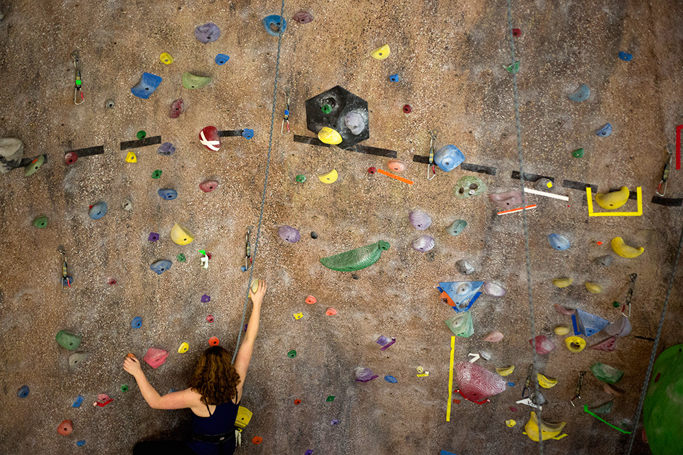 Jacqueline Kresse (SAR’19) climbing the rock wall at FitRec