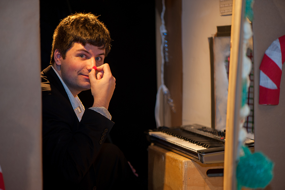 BU pianist wearing reindeer nose.