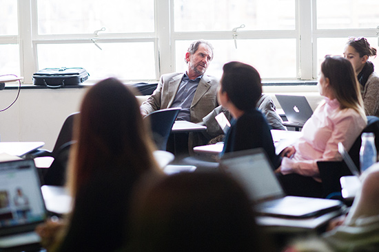 Steve Quigley sitting in front of his class