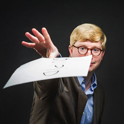 Tyler Perrachione, Assistant Professor at Boston University Sargent College of Health and Rehabilitation Sciences, holds a card showing a nonword used his dyslexia research