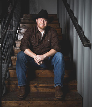 Lance Carpenter sitting on stairs