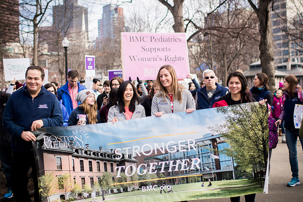 Boston Medical Center staff members holding 