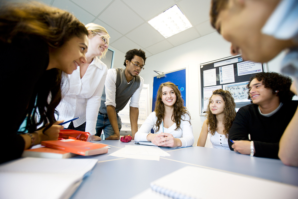 students having discussion at table