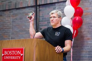 Edward Damiano holds a prototype of the iLet bionic pancreas he developed during an acceptance speech for the Boston University Innovator of the Year Award