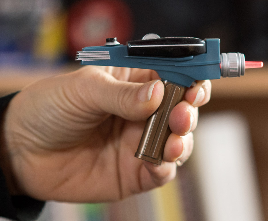 Karen Allen holds Star Trek phaser