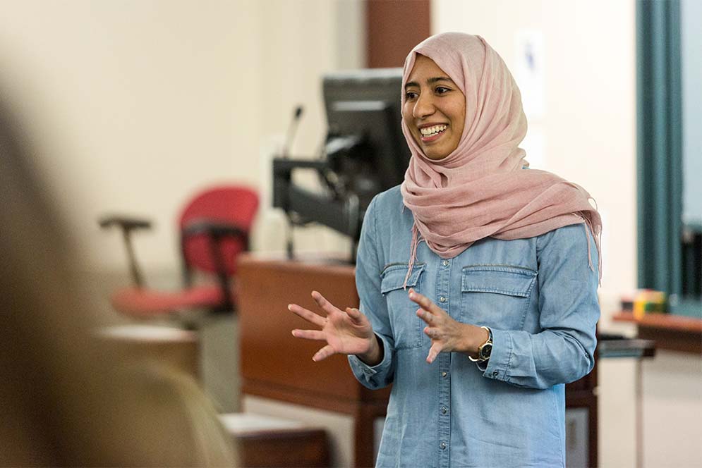 Boston University student Alaa Qari gives a presentation during the BUzz Lab Pitch and Pizza Competition
