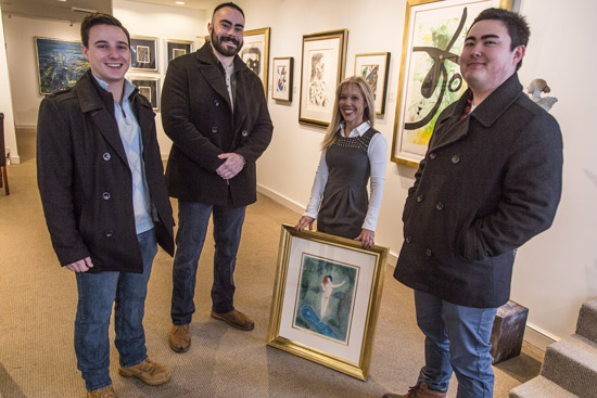 Susan Hirshberg poses with robbery thwarters Chris Savino, Mackenzie Thompson, and Jesse Doe