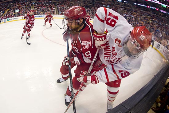 Clayton Keller fights for the puck up against the boards in Boston University's 6-3 loss to Harvard in the 65th Annual Beanpot Final